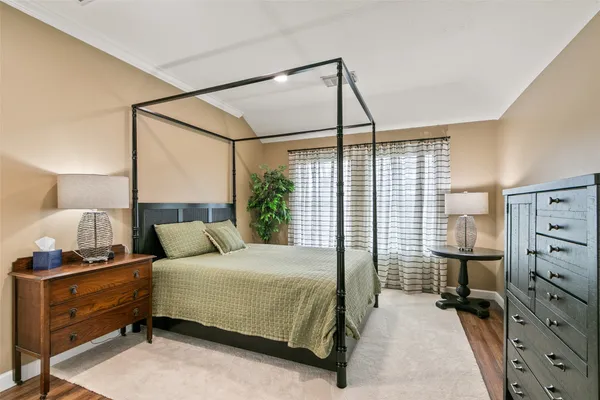 a bedroom with a bed and with cabinets