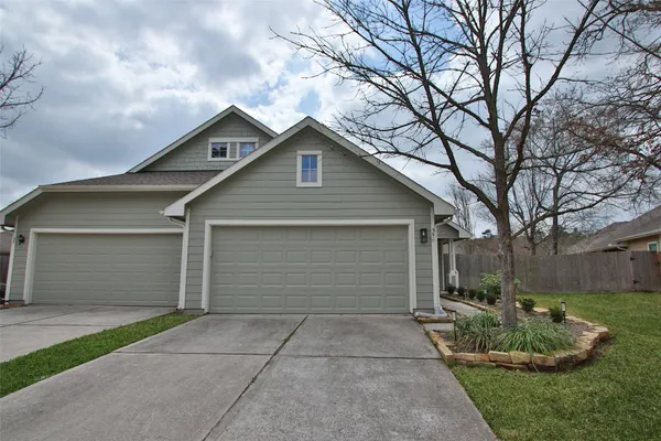 a front view of house with garage and yard