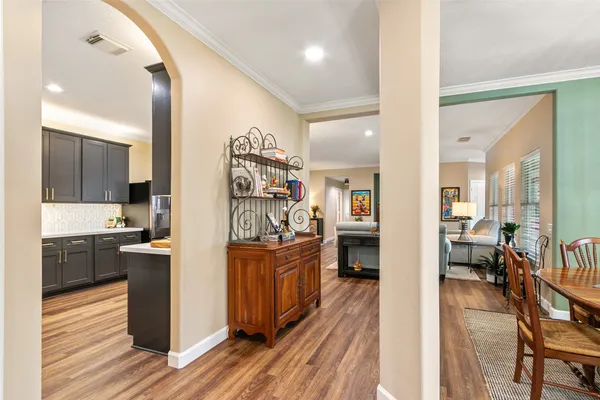a kitchen with stainless steel appliances granite countertop wooden floors and sink