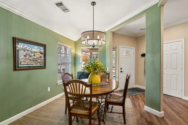 a dining room with furniture and window