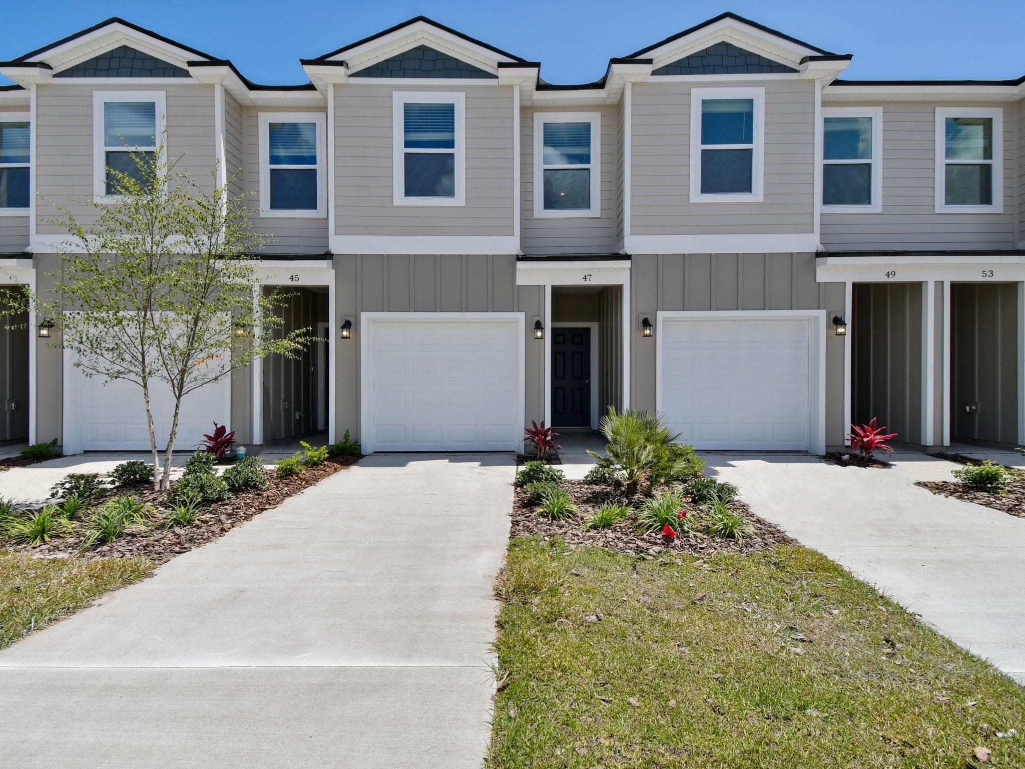 67 Pamplona Drive St. Augustine, FL 32086 - Photo 2 of 66 a front view of a house with garden