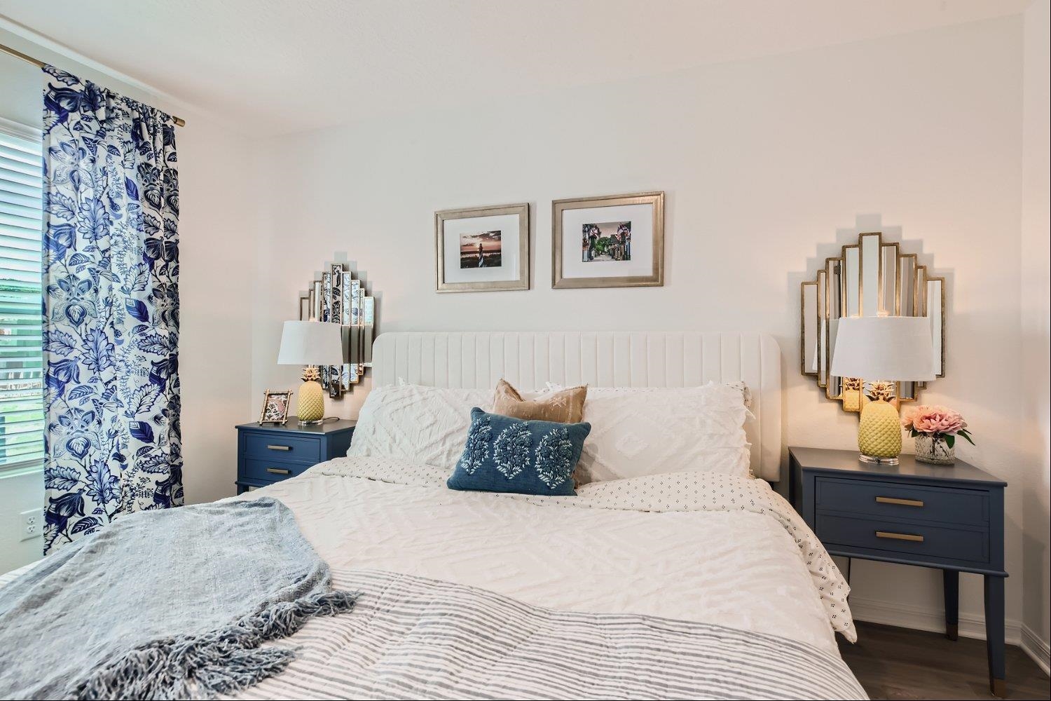 67 Pamplona Drive St. Augustine, FL 32086 - Photo 22 of 66 a bedroom with a large bed and a chandelier