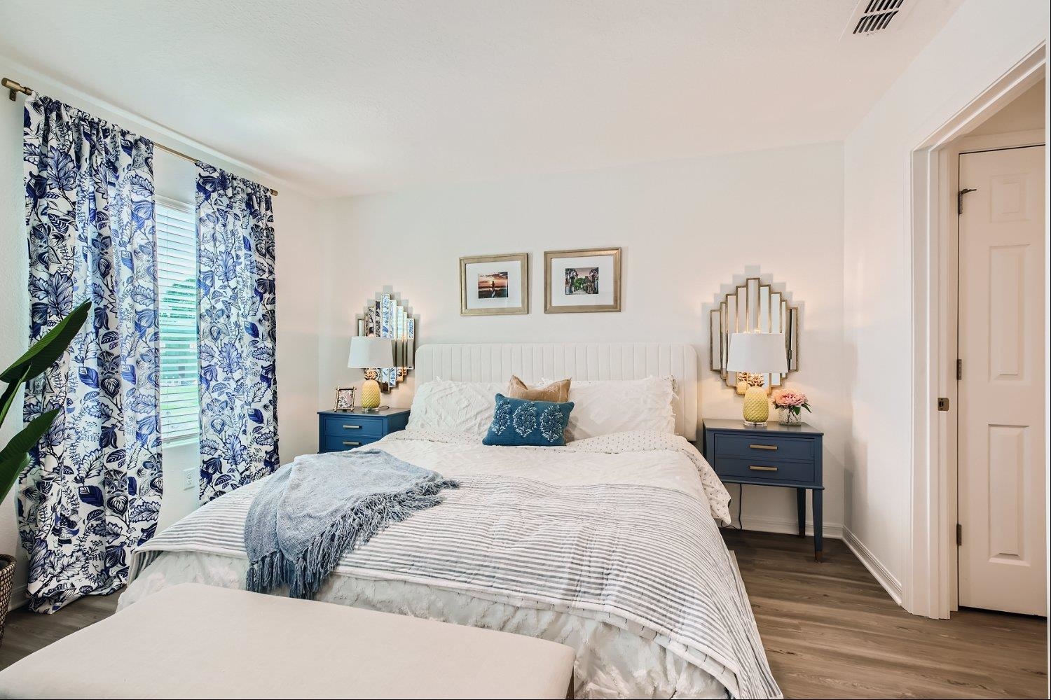 67 Pamplona Drive St. Augustine, FL 32086 - Photo 23 of 66 a bedroom with a large bed and a chandelier