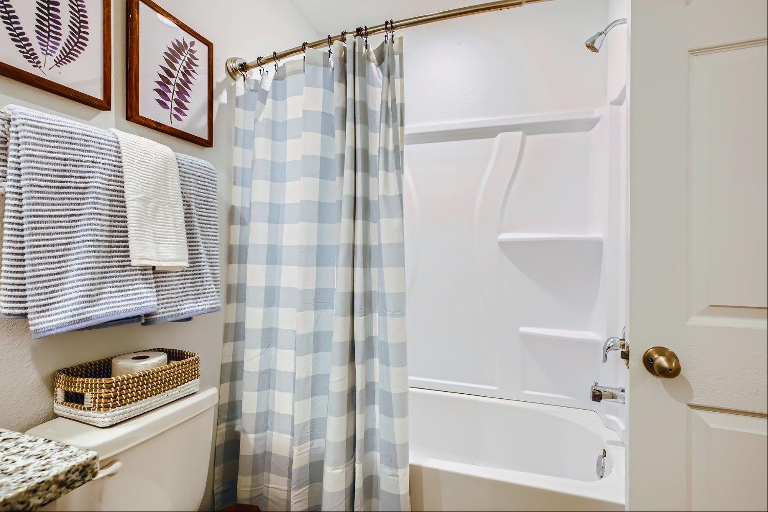 67 Pamplona Drive St. Augustine, FL 32086 - Photo 30 of 66 a bathroom with a shower curtain and a window