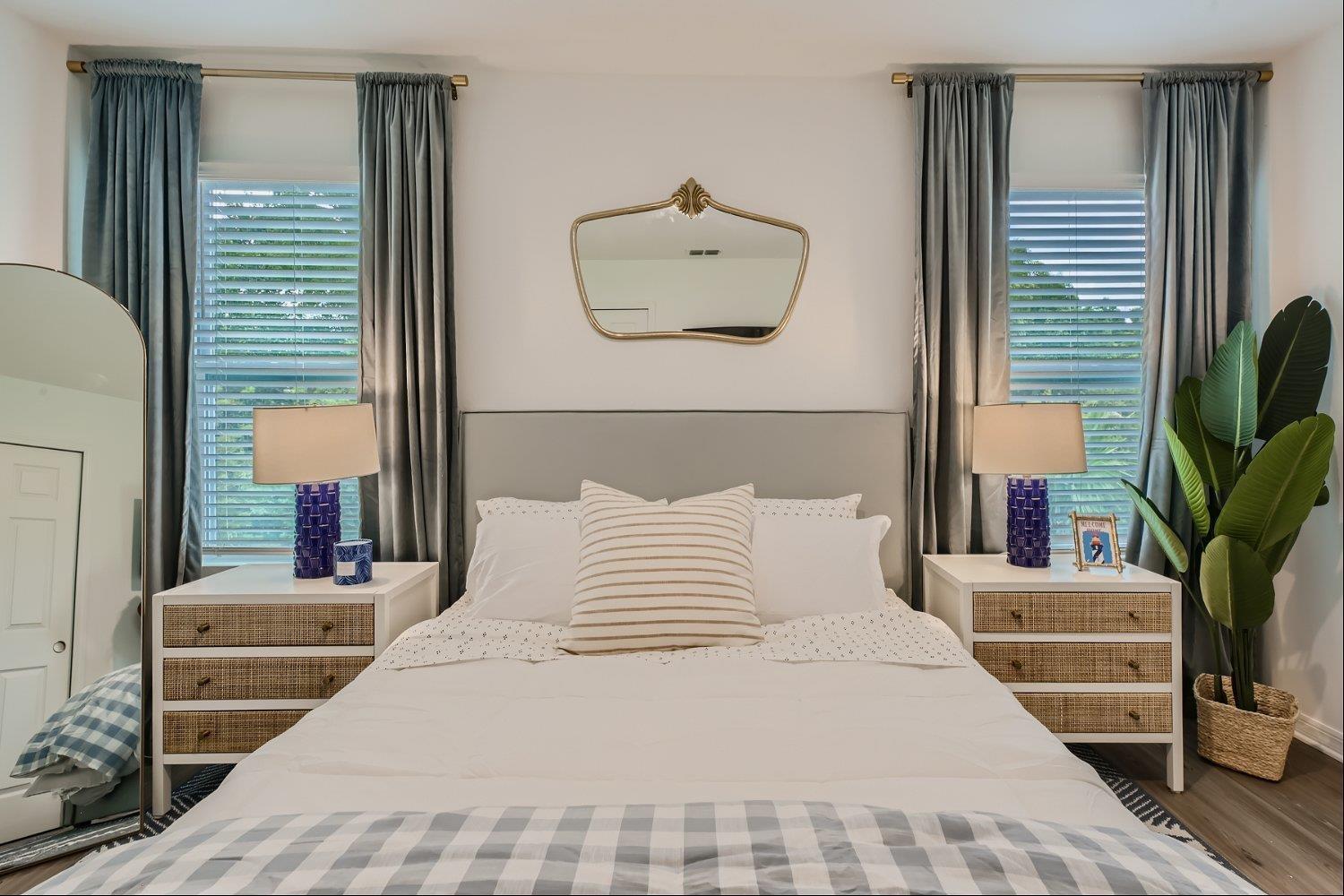 67 Pamplona Drive St. Augustine, FL 32086 - Photo 32 of 66 a bedroom with a large bed and a potted plant