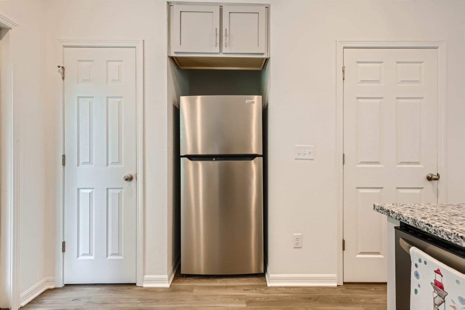 67 Pamplona Drive St. Augustine, FL 32086 - Photo 51 of 66 an empty room with wooden floor and cabinet