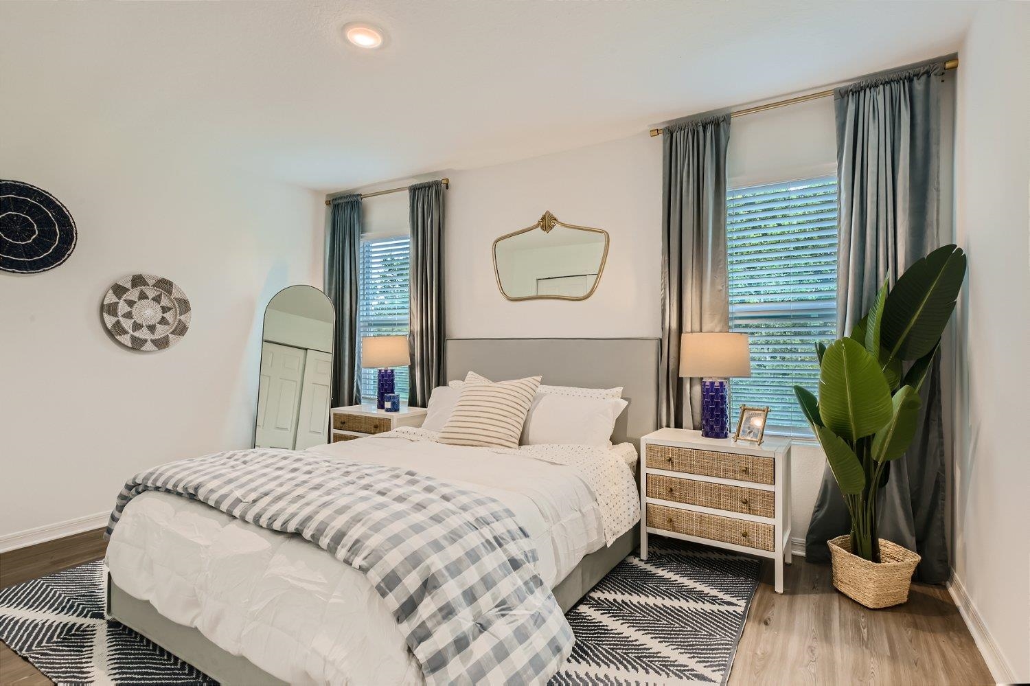 67 Pamplona Drive St. Augustine, FL 32086 - Photo 57 of 66 a bedroom with a bed a mirror and a window