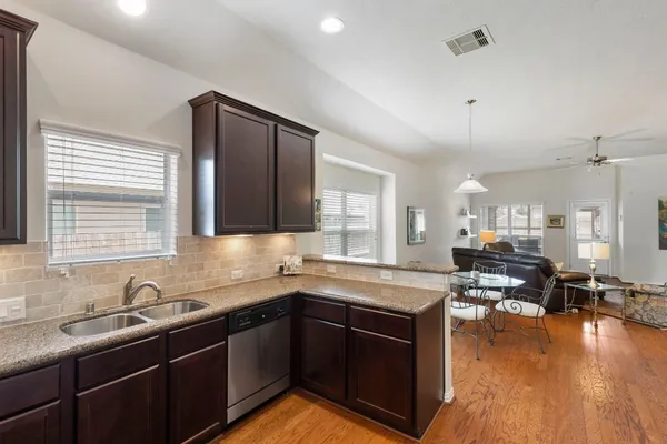 a kitchen with lots of counter top space and a sink
