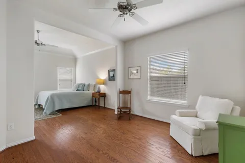 a bedroom with furniture and a window
