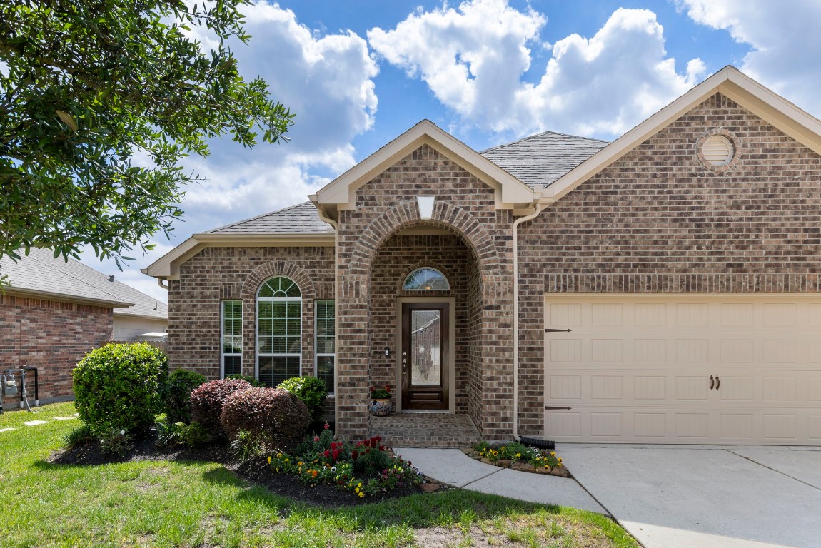 3214 Clover Trace Drive Spring, TX 77386 - Photo 2 of 48 a front view of a house with garden