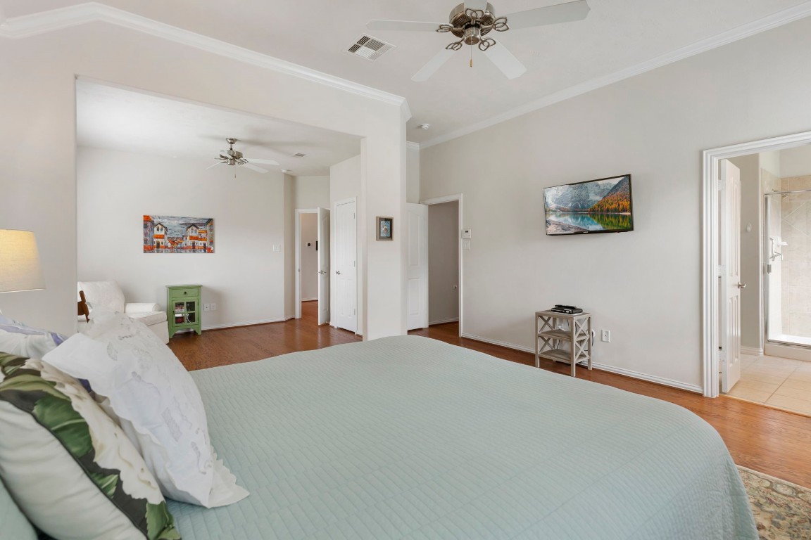 3214 Clover Trace Drive Spring, TX 77386 - Photo 22 of 48 a bedroom with a bed and a chandelier