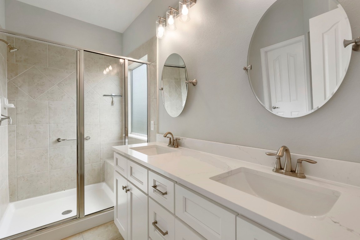 3214 Clover Trace Drive Spring, TX 77386 - Photo 26 of 48 a bathroom with a double vanity sink mirror and double