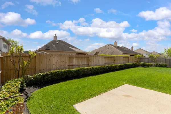 a view of a back yard of the house