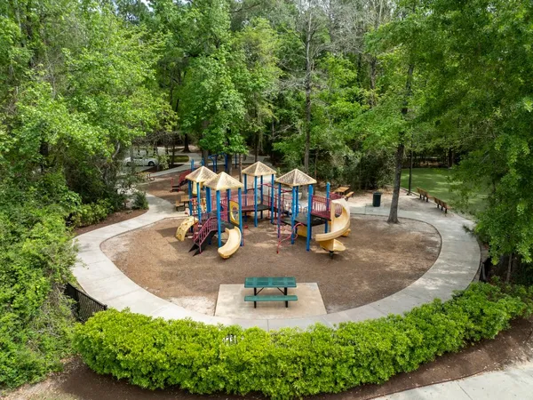 swimming pool view with a garden