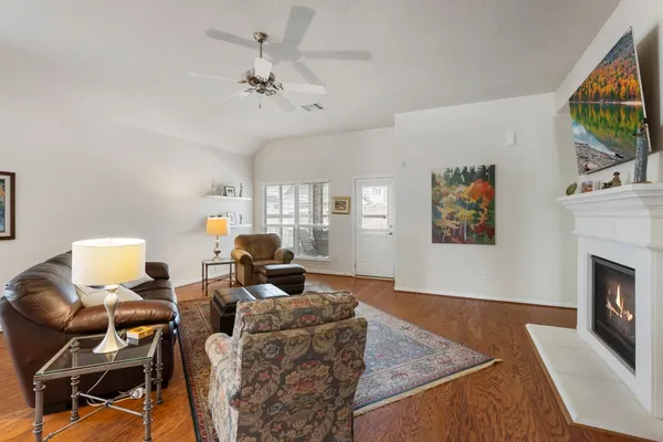a living room with furniture and a fireplace