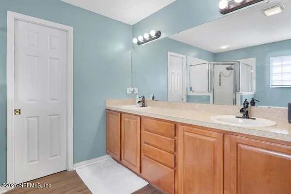 a spacious bathroom with a sink a mirror and a vanity