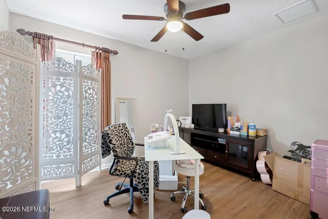 a workspace with furniture and a window