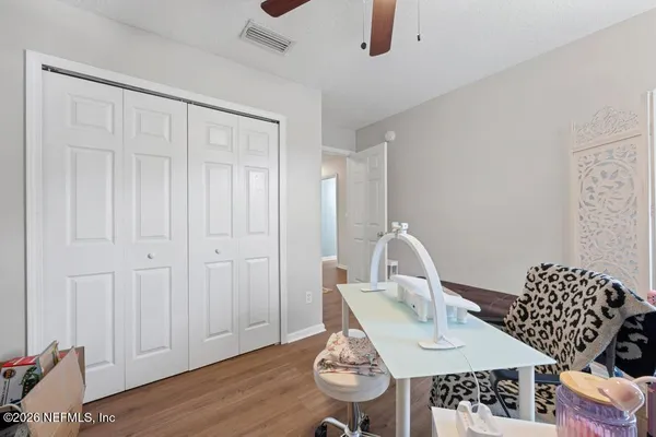 a view of a workspace with furniture