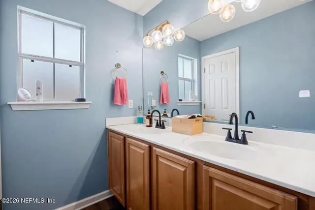 a bathroom with a sink and a mirror