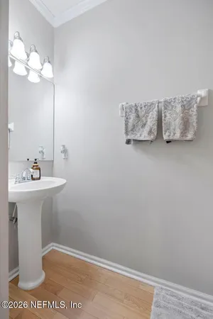 a bathroom with a sink mirror and vanity