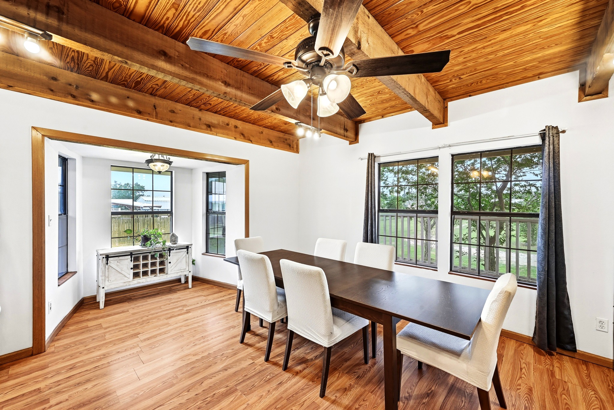 320 Sunset Ridge Maxwell, TX 78656 - Photo 15 of 32 a view of a dining room with furniture window and wooden floor