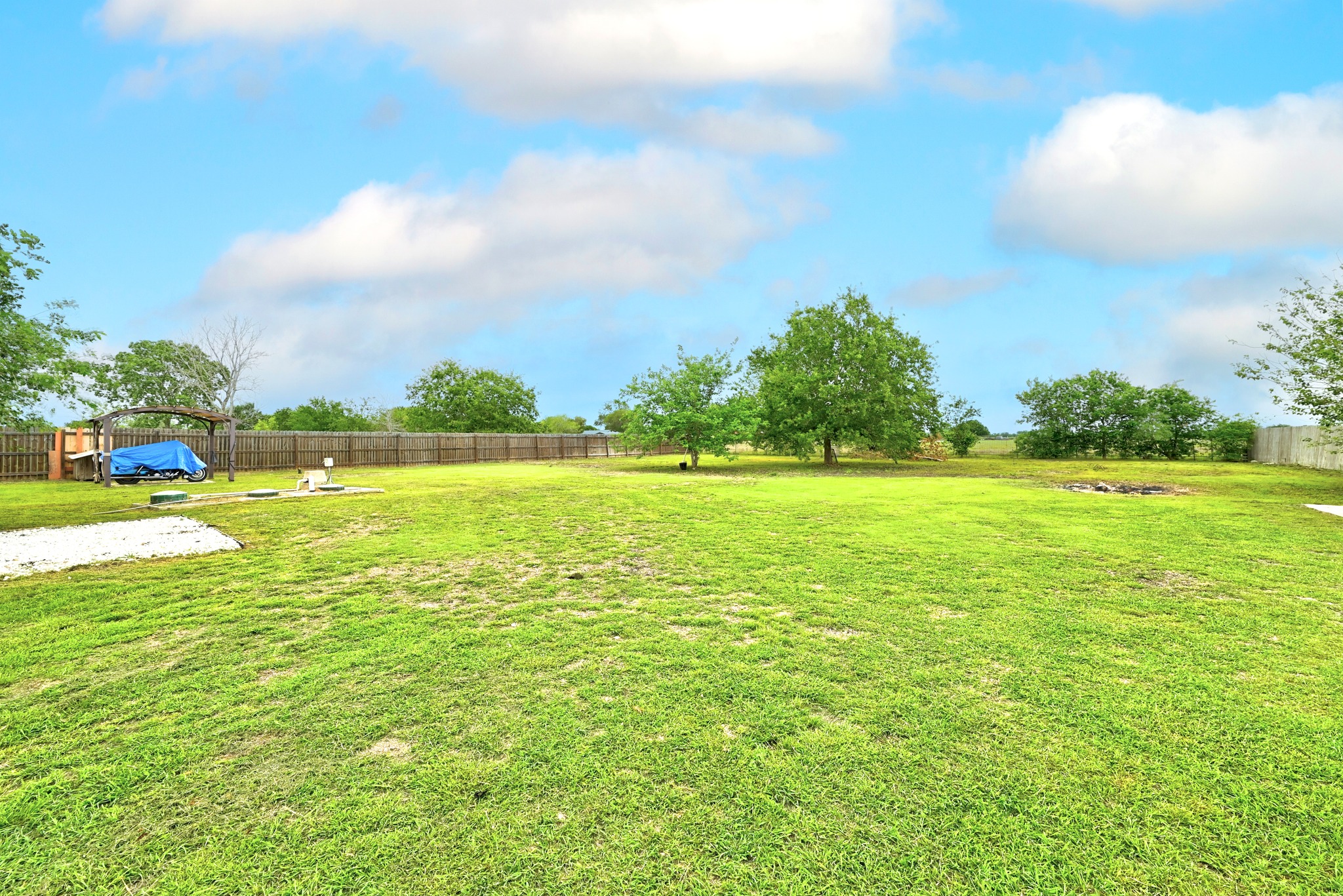 320 Sunset Ridge Maxwell, TX 78656 - Photo 28 of 32 a view of a swimming pool and a yard