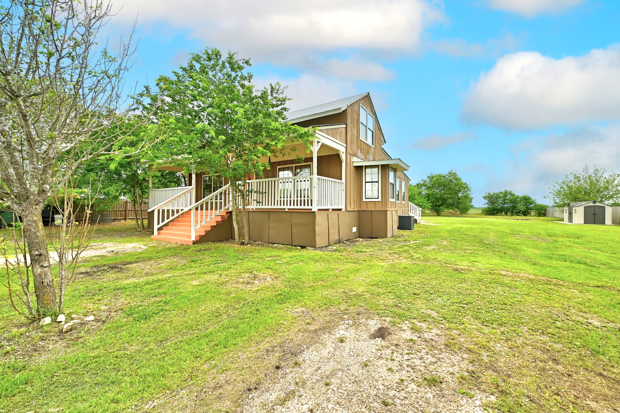 320 Sunset Ridge Maxwell, TX 78656 - Photo 3 of 32 a view of a house with backyard and garden