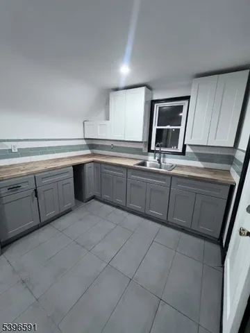 a kitchen with cabinets and sink