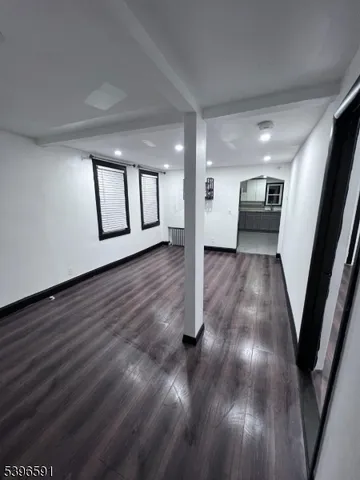 a view of livingroom and hardwood floor