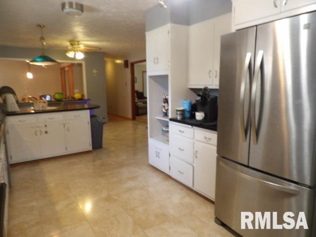 736 North Mill Street Carrier Mills, IL 62917 - Photo 9 of 35 a large kitchen with cabinets and stainless steel appliances