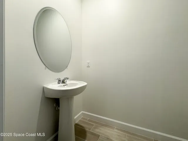 a bathroom with a sink and mirror