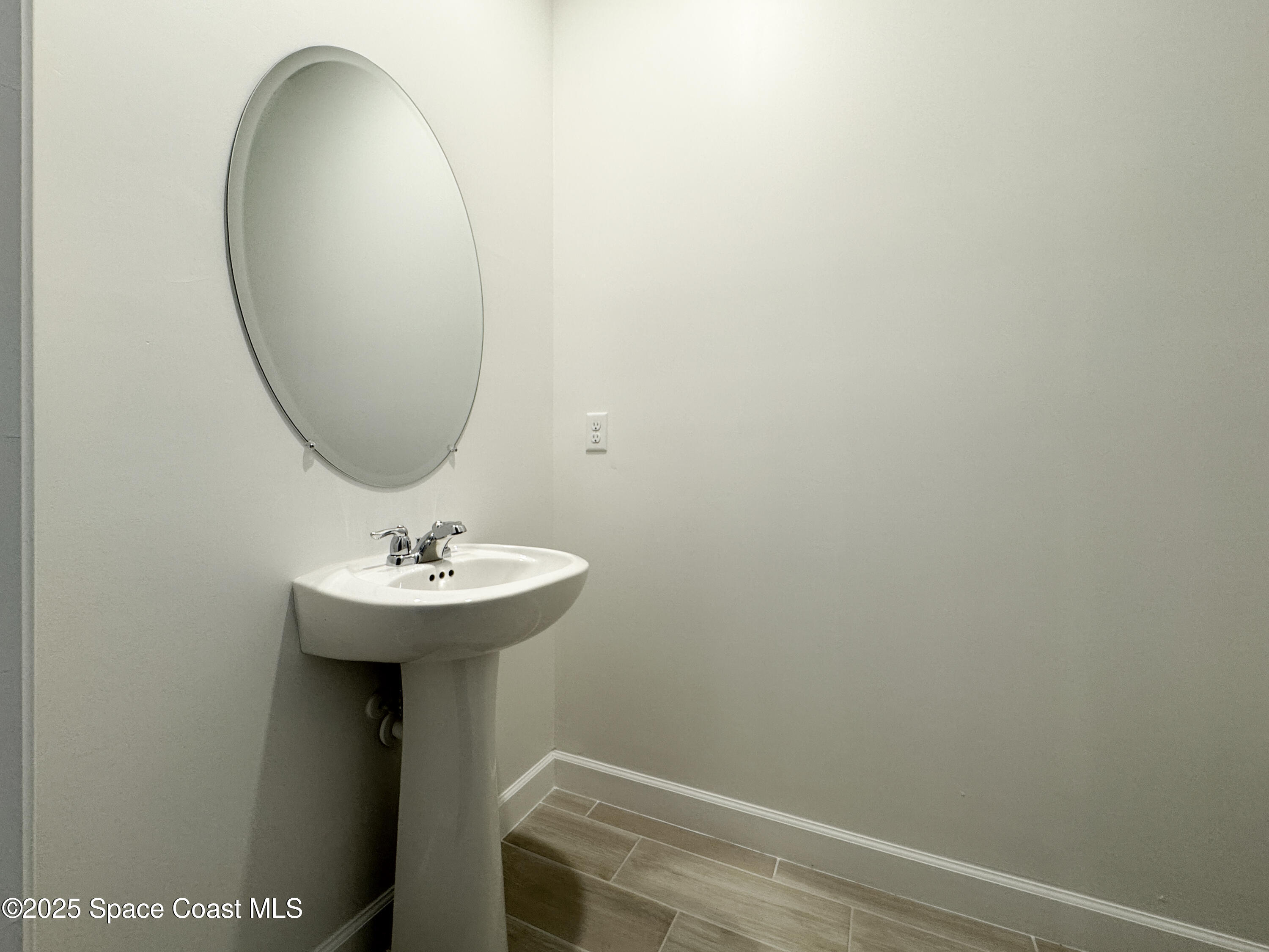 1959 Croft Inlet Drive Palm Bay, FL 32907 - Photo 11 of 23 a bathroom with a sink and mirror
