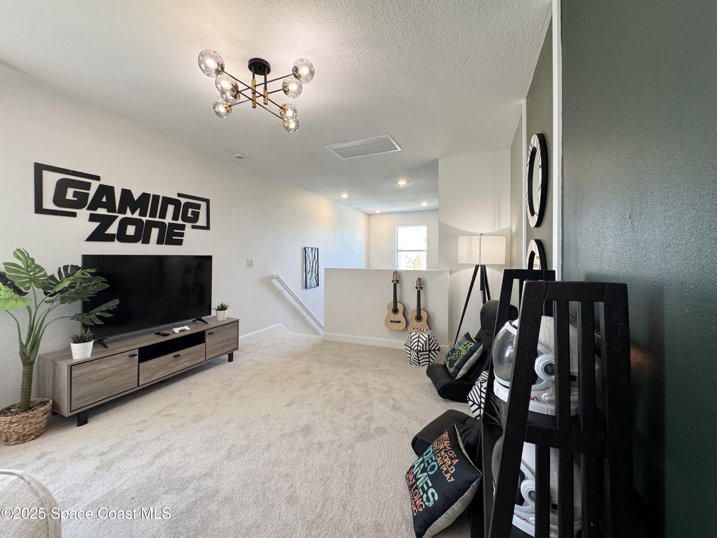 1959 Croft Inlet Drive Palm Bay, FL 32907 - Photo 14 of 23 a view of a livingroom with furniture and a flat screen tv