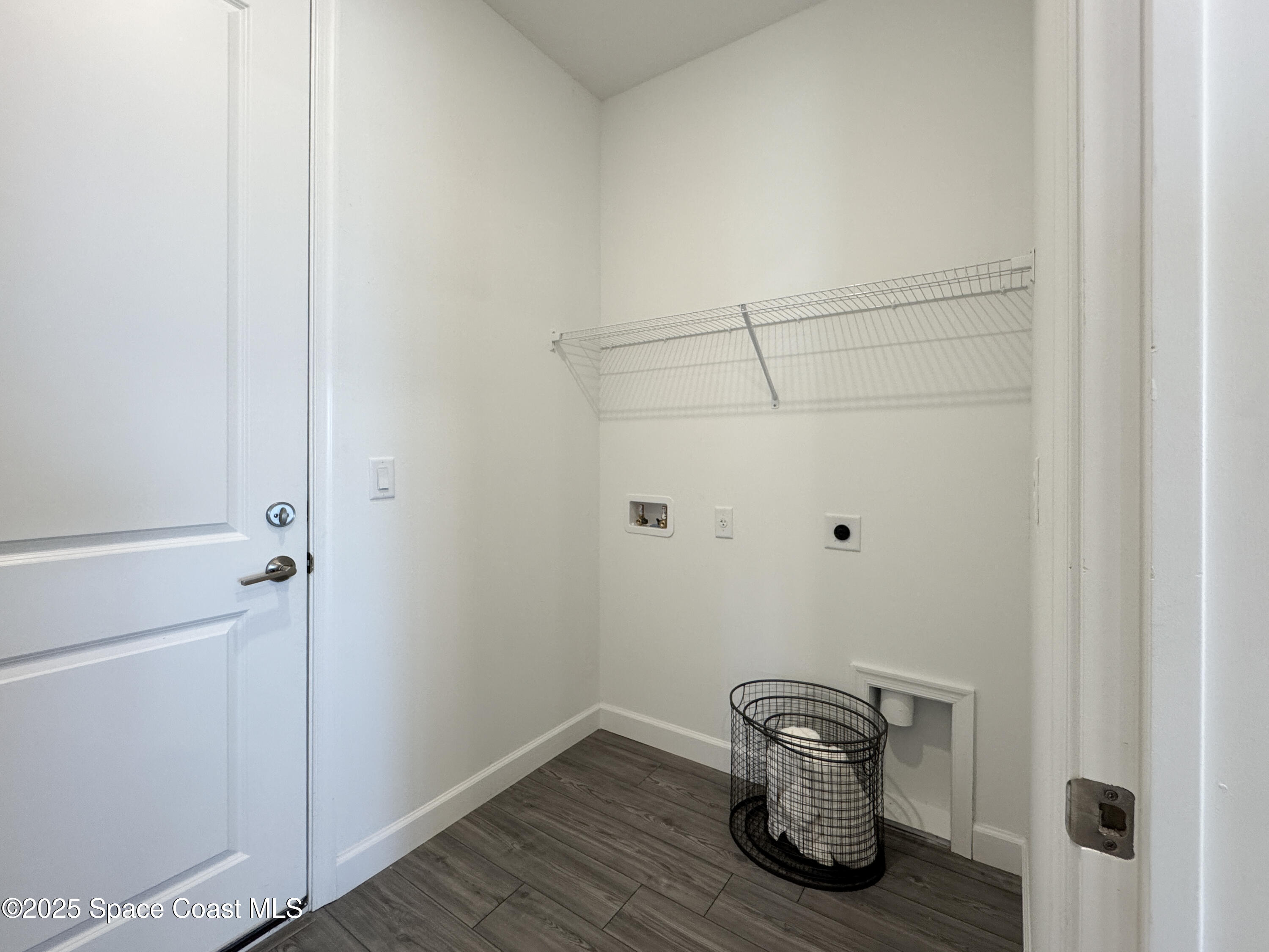 1959 Croft Inlet Drive Palm Bay, FL 32907 - Photo 16 of 23 a view of a hallway with wooden floor