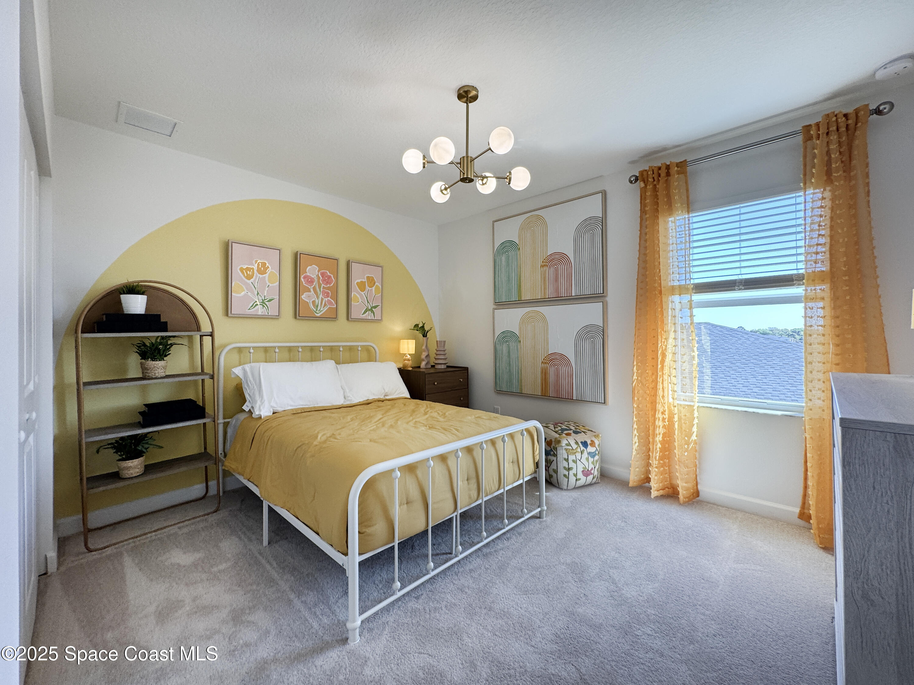 1959 Croft Inlet Drive Palm Bay, FL 32907 - Photo 17 of 23 a bedroom with a bed and a chandelier
