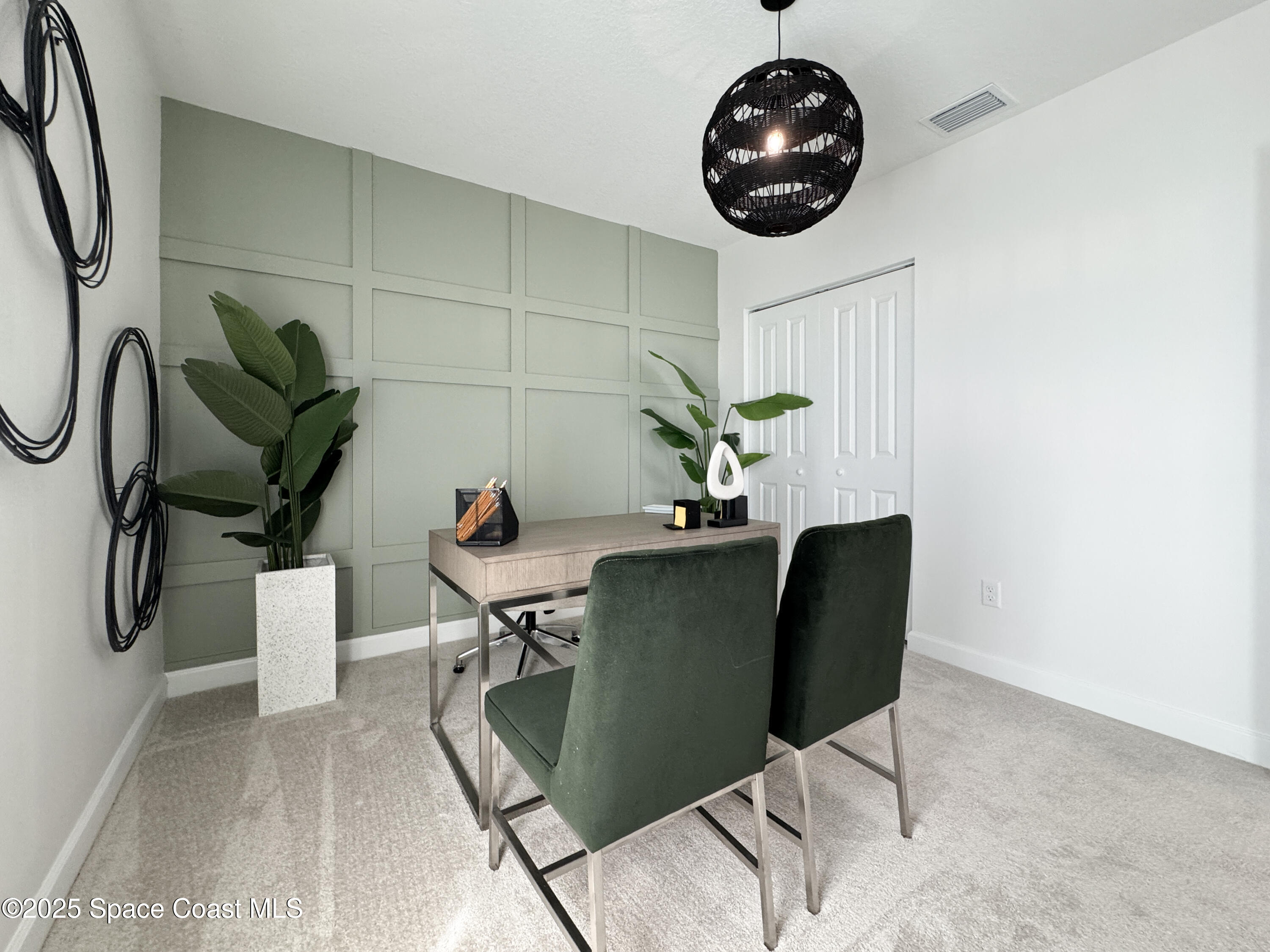 1959 Croft Inlet Drive Palm Bay, FL 32907 - Photo 18 of 23 a living room with furniture and a chandelier