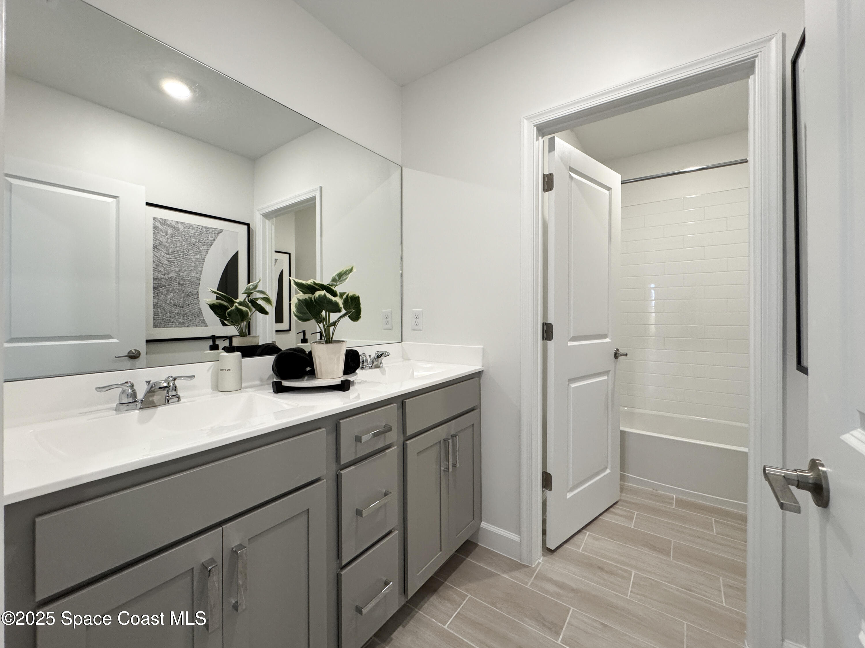 1959 Croft Inlet Drive Palm Bay, FL 32907 - Photo 19 of 23 a bathroom with a double vanity sink mirror and shower