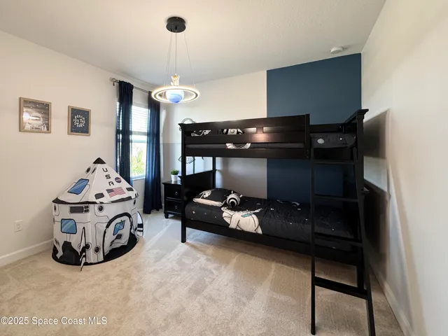 a living room with hard wood flooring and furniture