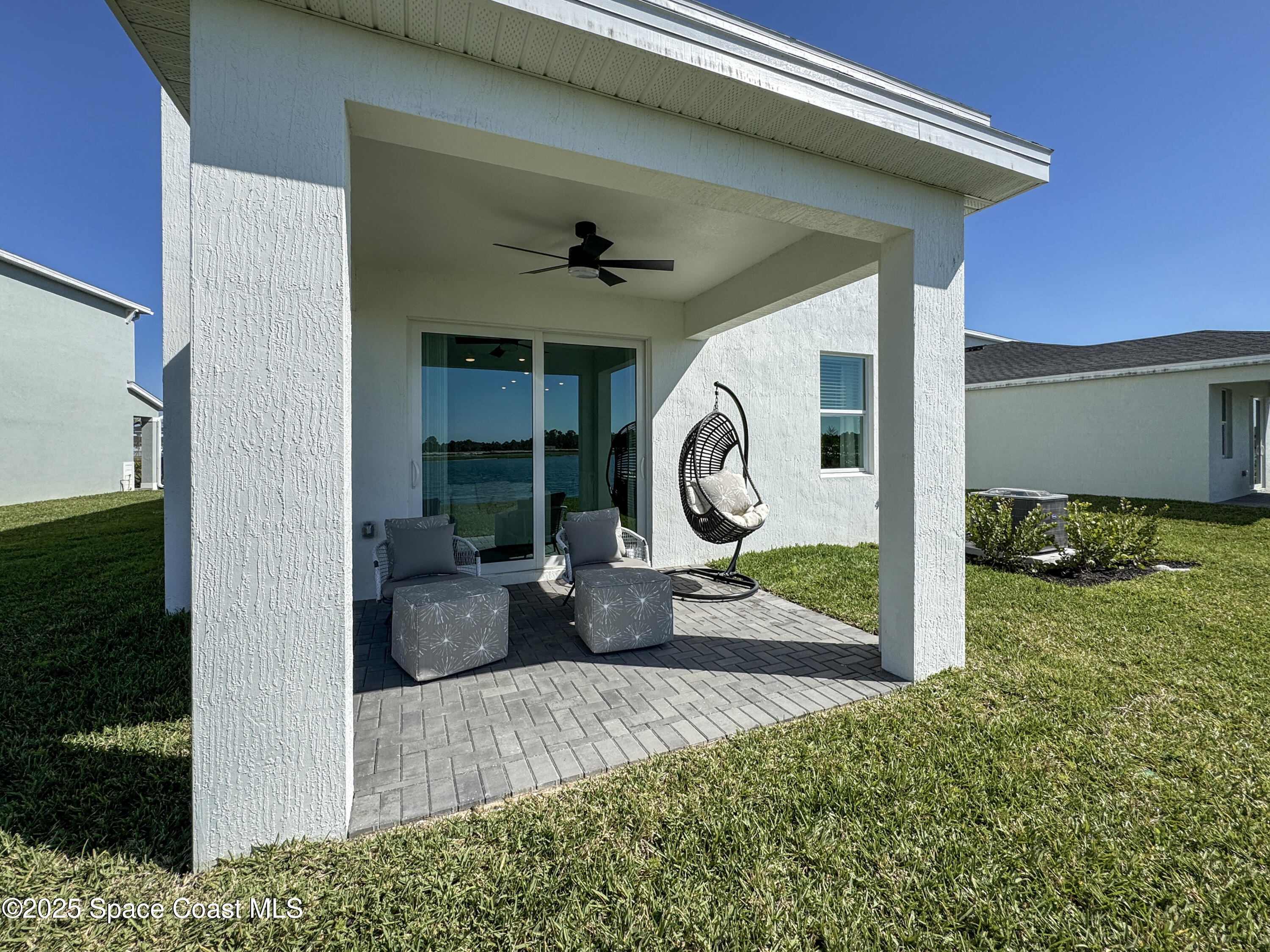 1959 Croft Inlet Drive Palm Bay, FL 32907 - Photo 22 of 23 a view of a porch with a table and chairs