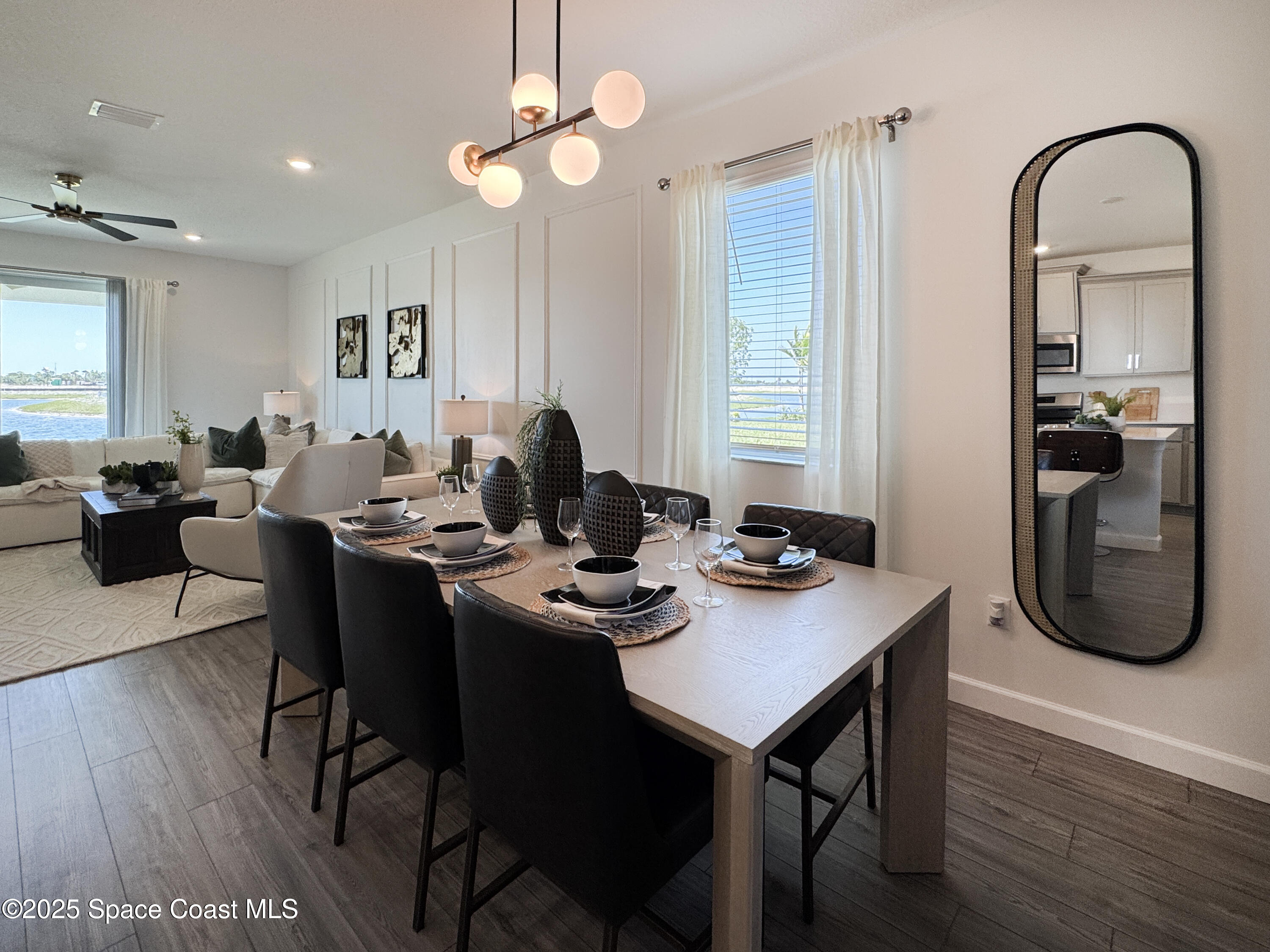 1959 Croft Inlet Drive Palm Bay, FL 32907 - Photo 5 of 23 a view of a dining room with furniture window and wooden floor