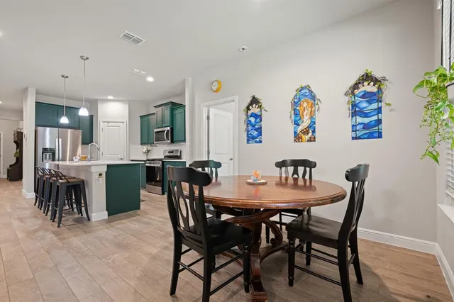 a view of a dining room with furniture