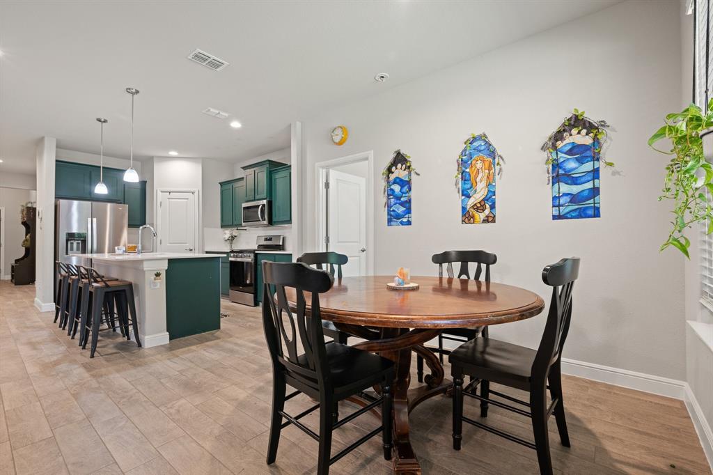 5709 Round Hl Road Denton, TX 76210 - Photo 13 of 31 a view of a dining room with furniture