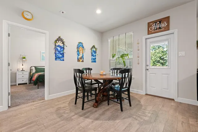 a view of a dining room with furniture window and outside view