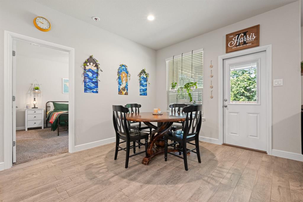 5709 Round Hl Road Denton, TX 76210 - Photo 14 of 31 a view of a dining room with furniture window and outside view