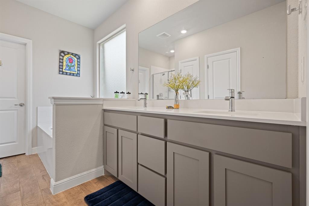 5709 Round Hl Road Denton, TX 76210 - Photo 18 of 31 a bathroom with a sink and a mirror