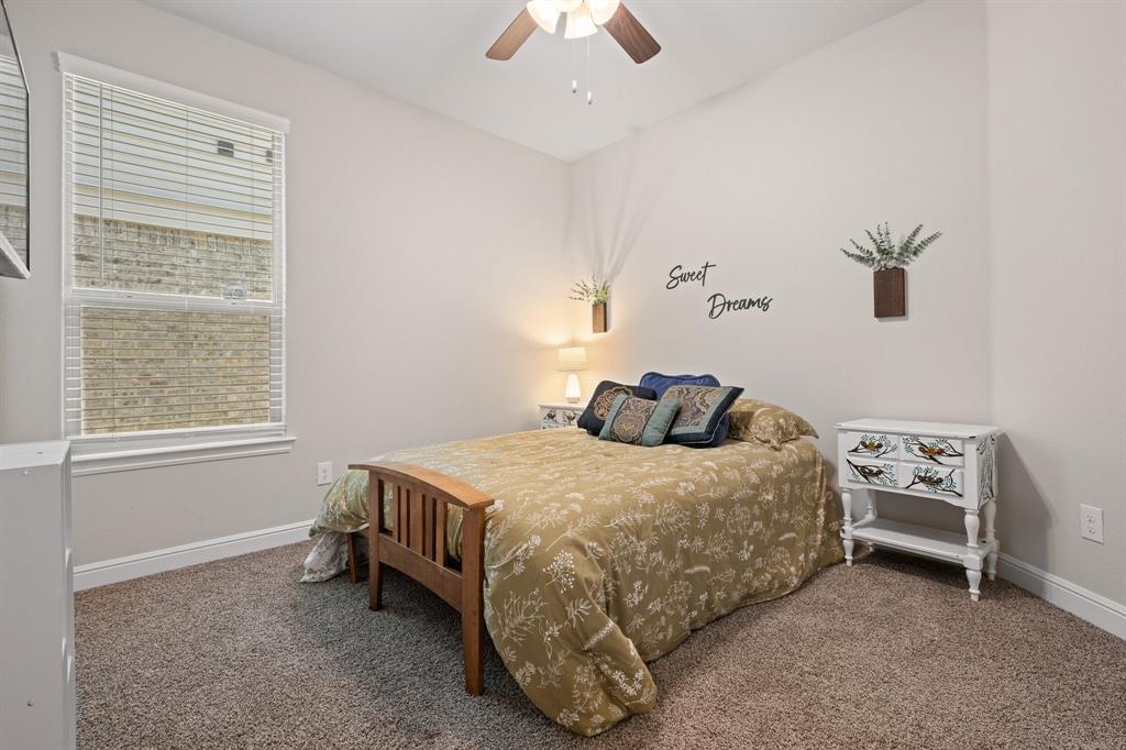 5709 Round Hl Road Denton, TX 76210 - Photo 21 of 31 a bedroom with a bed and a window
