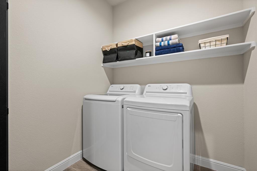 5709 Round Hl Road Denton, TX 76210 - Photo 24 of 31 a utility room with dryer and washer
