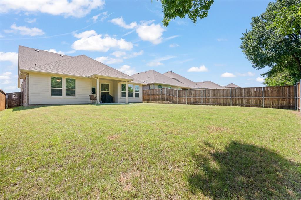 5709 Round Hl Road Denton, TX 76210 - Photo 29 of 31 a view of a house with a big yard and potted plants