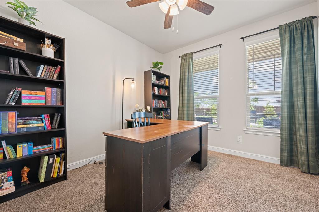 5709 Round Hl Road Denton, TX 76210 - Photo 4 of 31 a room with furniture and a book shelf