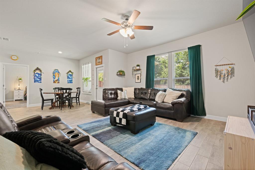 5709 Round Hl Road Denton, TX 76210 - Photo 10 of 31 a living room with furniture and wooden floor